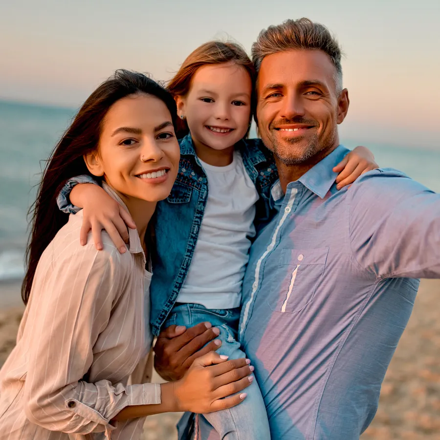 Family smiling together outdoors