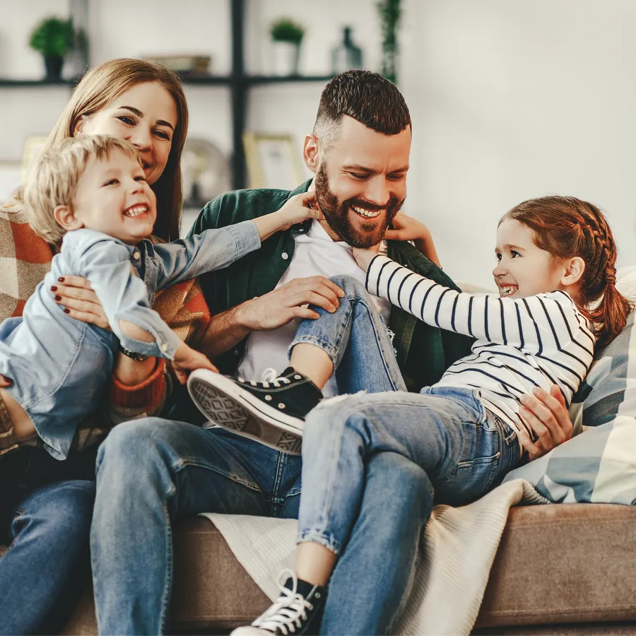 Happy family relaxing together at home